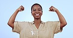 Woman, smile and strength in power in studio for health, wellness or campaign on blue background for mock up. Female, person or survivor with hands raised in happiness for support, vote or success

