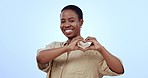 Face, heart hands and black woman with support, promotion and icon on blue studio background. Portrait, African person and model with symbol for love, kindness and feedback with aesthetic and review
