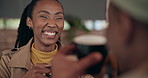 Couple, woman and man with coffee on date at restaurant or cafe for relationship, romance and talking. Black people, tea and communication with laughing, joke and bonding on weekend for love and care