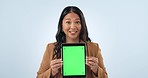 Professional woman, tablet green screen and presentation, website space, business information or advertising in studio. Face of Asian employee, digital mockup and tracking marker on a blue background