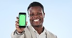Happy black man, phone and green screen for marketing or advertising against a studio background. Portrait of African businessman smile and showing mobile smartphone app, display or mockup space