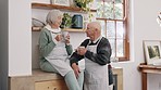 Latte, conversation and senior couple in kitchen for communication, talking and bonding together. Happy, discussion and elderly man and woman in retirement speaking and drinking coffee at home.