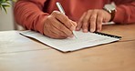 Senior man, hands and writing on paperwork, form or application for retirement, life insurance or finance. Closeup of mature male person filling in documents, signature or legal agreement at home