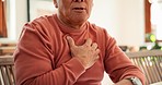 Heart attack, zoom and senior man in his home coughing, problem or breathing, risk or emergency. Chest pain, hands and elderly guy person with anxiety, asthma or heartburn, choke or stress in a house