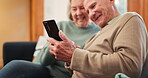 Senior couple, relax and reading on sofa with phone, app or streaming a video on social media with internet. Scroll, cellphone or people in retirement with online news, website or post in living room