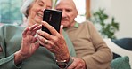 Hands, senior couple and smartphone in home to scroll online, reading notification and news app on sofa. Closeup, old man and woman with parkinson typing on cellphone, social media and mobile contact