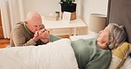 Bed, sick and senior couple for care holding hands for support, bonding and empathy at home together. Retirement home, marriage and elderly man and woman in bedroom for illness, healing and recovery