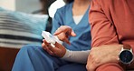 Woman, nurse and hands with medication in consultation for healthcare advice, prescription or dose on sofa at home. Closeup of female person or medical doctor talking to patient with pills at house