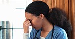 Healthcare, stress and woman doctor with headache, mistake or trauma in a consultation room with regret. Hospital, fail and female nurse disappointed with loss, burnout or grief, guilt or anxiety