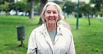 Senior woman, smile and face in park, nature or happiness outdoor for walk, exercise or wellness in retirement. Happy, elderly lady or portrait on path in New York and freedom or peace in environment