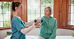 Office, nurse and senior woman with fitness, stretching and healthcare with rehabilitation, wellness or talking. Mature person, patient and elderly lady with caregiver, physical therapist or exercise