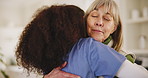 Senior woman, happy or caregiver with hug for healthcare support, empathy or hope at nursing home. Smile, care or friendly nurse speaking to mature female patient or sick person with cancer in clinic