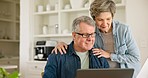 Senior man, woman and taxes with laptop, kiss and glasses for reading, thinking or check paperwork. Old people, couple and documents for budget, investment and financial review with hug by pc in home