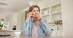 Phone call, communication and senior woman in the kitchen of retirement home for discussion. Chat, technology and elderly female person on mobile conversation with cellphone in modern house.