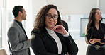 Face, smile and confident business woman in the office with an employee team for collaboration or leadership. Portrait, corporate and happy young professional employee in the workplace with her team