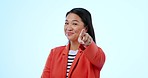 Woman, pointing at you and smile with offer in studio for recruitment in mock up on blue background. Asian person, face and we are hiring in excitement for opportunity with vision, career and choice