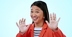 Woman, smile and face or stop with hands in studio by blue background, ooh and wait for crazy gossip. Happy asian model, funny and no to inappropriate joke, portrait and humor or comedy in mockup