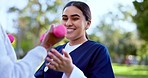 Fitness, caregiver and hand with dumbbell for exercise, wellness and physiotherapy outdoor at park with smile. Nurse, person and workout, training or physical therapy for healthy body and happiness