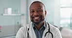 Healthcare, doctor and face of black man at hospital with smile for support, service and wellness. Medicine, professional and African expert with happiness and pride for career, surgery or insurance