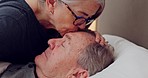 Love, old man and woman kiss face in bed with care, kindness and support in home, bedroom or hospital. Elderly,  couple and caregiver kissing person sleeping in clinic, hospice or house in retirement