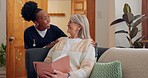 Tablet, nurse and senior woman on sofa browsing on internet for medical consultation research. Bond, healthcare and African female caregiver talk to elderly patient networking on technology at home.