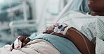 Patient hand, bed and drip in closeup, hospital or treatment for hydration, liquid or supplement. Person, healthcare and wellness with blood transfusion, anesthesia or pharma drugs for pain in clinic