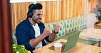 Laptop, coffee shop and man celebrate, excited and happy for online notification, restaurant report or customer experience review. Freelancer, remote work and winner cheers for cafeteria announcement