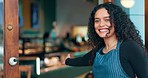 Coffee shop door, welcome gesture or happy woman, cafe waitress and barista hospitality smile at storefront entrance. Cafeteria greeting, small business worker and enter for commerce industry service