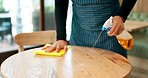 Waitress hands, spray and cleaning table for hygiene, bacteria or shine in coffee shop with liquid. Person, barista and cleaner with ppe gloves, chemical or cloth for catering, restaurant or cafe job