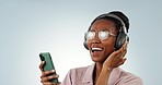 Singing, phone or black woman listening to music, podcast or radio audio on subscription in studio. Dance, headphones or happy person streaming a song isolated on a white background on mobile app