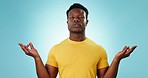 Hands, meditation and black man in studio with breath, exercise or mental health wellness on blue background. Relax, zen and guy model with yoga pose for stress management, mindfulness or balance