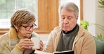 Coffee, bible and senior couple in home for religion, spiritual learning and faith. Christianity, retirement and elderly man and woman reading holy book for bonding, relax or worship in living room