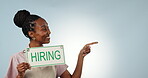 Pointing, face or manager with hiring sign, job advertising or cafe promo mockup space in studio. Yes, happy or black woman by poster board text, work opportunity or recruitment on blue background