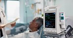 Patient, doctor and heart monitor, health and help with advice, vital sign or numbers with rehabilitation in hospital. People with healthcare, screen and medical emergency, cardiology and EKG machine