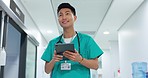 Doctor, nurse and smile on tablet for hospital services, thinking of healthcare and typing information online. Medical worker or Asian man in China with digital technology, clinic inspection or ideas