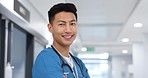 Healthcare, face and asian man or doctor with smile for wellness, trust and service in hospital or clinic. Portrait, person and expert with happiness for career, cardiology or nursing at workplace