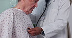 Senior man, doctor and breathing on stethoscope, checkup and consultation in hospital, health issue and lungs. Elderly, healthcare service and cardiology for patient, retired and old age sickness