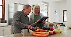 Old couple in kitchen, cooking together with tablet and help with online recipe for vegetable nutrition idea. Healthy food, senior man and woman in home with digital app for meal prep, diet and lunch