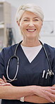 Vet, arms crossed and happy mature woman confident in medical career, animal clinic or healthcare support work. Job experience, portrait and professional expert for veterinary care, help or service