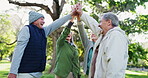 Elderly people, high five and teamwork in nature support, trust or motivation together for outdoor community. Mature or retired group touching hands in team building, collaboration or unity at park