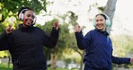 Nature fitness, happy and women dancing, having fun and listening to exercise music, workout playlist or podcast. Energy, headphones and outdoor people, dancer or athlete cardio, training or wellness