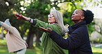 Yoga class, park and senior people with instructor exercise together in nature for health and wellness training. Peace, balance and elderly people outdoor workout or stretching for body fitness