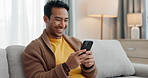 Home phone, relax and happy man typing communication, funny social media message or contact online user. Living room sofa, mobile smartphone connection and person search internet, web or application