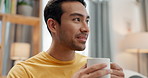 Asian man, coffee or aroma and drink with smile for smell, morning espresso or breakfast with satisfied face. Relax, person or happiness with mug for energy, inspiration or break on sofa in lounge