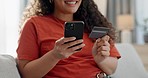 Happy woman, hands and phone with credit card for payment, online shopping or banking on sofa at home. Closeup of female person shopper smile with debit and mobile smartphone in bank app or ecommerce