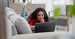 Woman lying on sofa with laptop, headphones and smile on social media, video streaming chat or movie website. Relax, internet and happy girl on couch with computer with earphones, film audio or app.