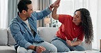 Couple, high five and home budget, financial success and taxes celebration, goals or achievement on living room sofa. happy interracial people and hands together for investment or insurance documents