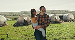 Man carrying child on farm, agriculture and bonding, parent and kid with love and care, grass field and nature in countryside. Chicken, poultry farmer with father and daughter outdoor with livestock