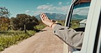 Road trip, window and hand of person in car for travel, holiday and vacation on drive in countryside road. Nature, wind and motor vehicle for transport on adventure, freedom and journey outdoors