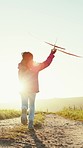 Child in field with plane toy, running and playing with freedom, nature and girl on path from back. Happiness, summer fun and playful kid with airplane in countryside for adventure, sunshine and sky.